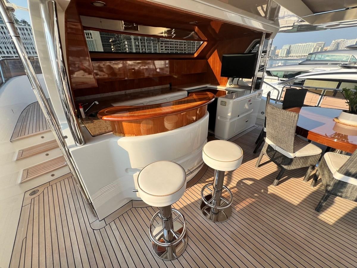 a room with a table and chairs aboard 2009 BENETTI 85 LEGEND Yacht for Sale