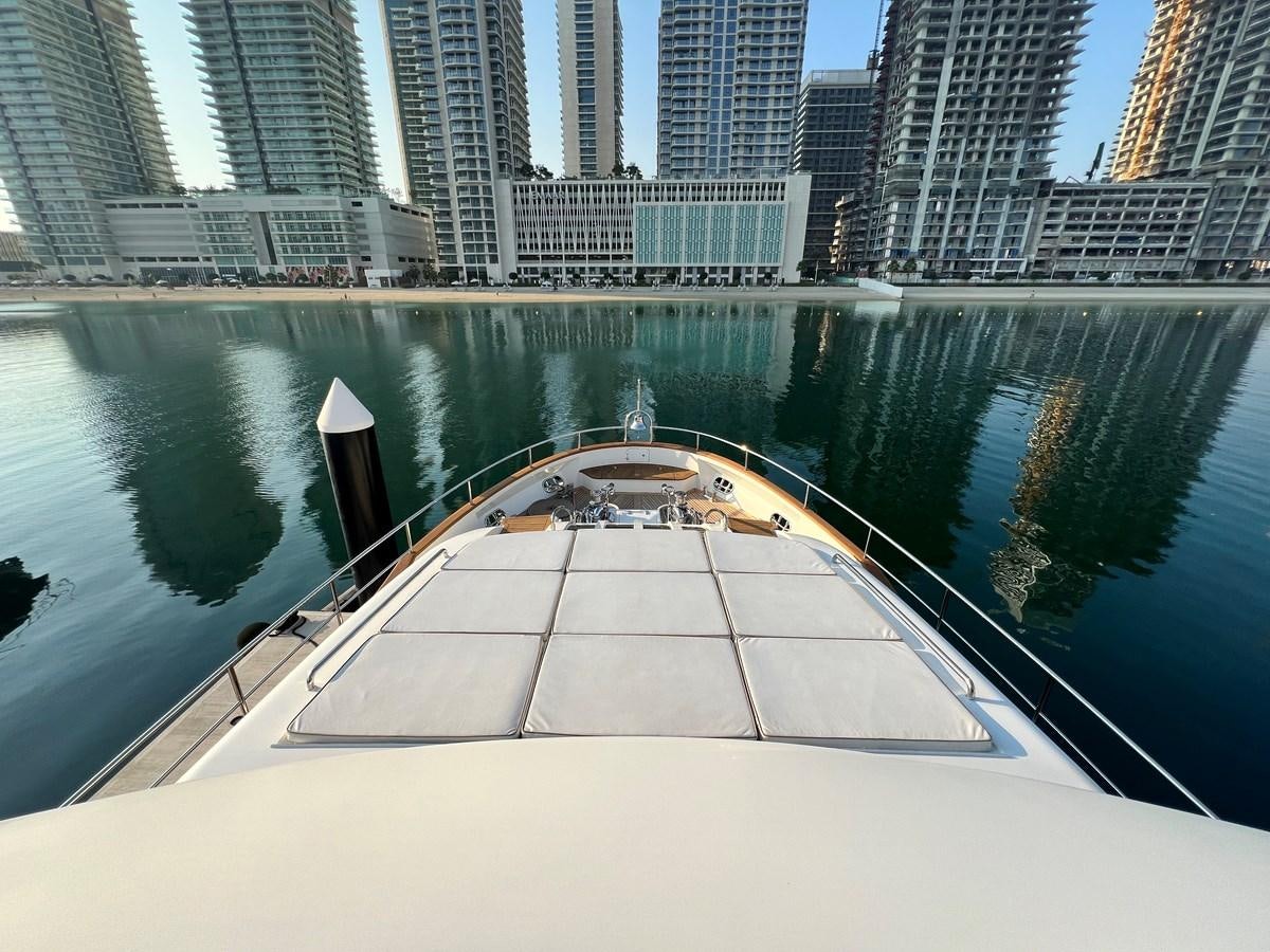 a pool with a city in the background aboard 2009 BENETTI 85 LEGEND Yacht for Sale