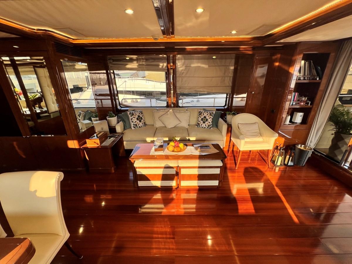 a room with a table and chairs aboard 2009 BENETTI 85 LEGEND Yacht for Sale
