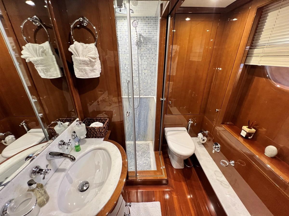 a bathroom with a sink and a shower aboard 2009 BENETTI 85 LEGEND Yacht for Sale