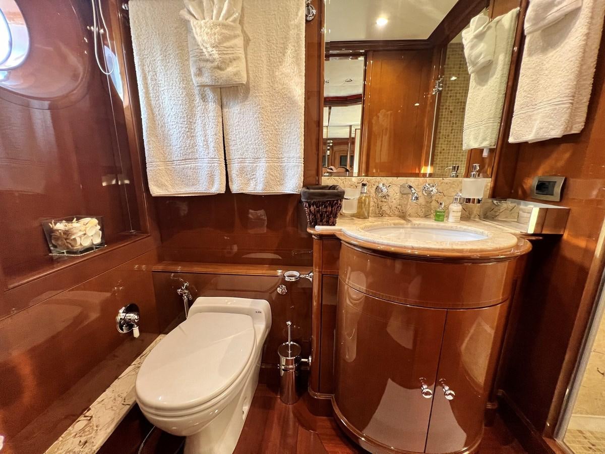 a bathroom with a sink and a toilet aboard 2009 BENETTI 85 LEGEND Yacht for Sale