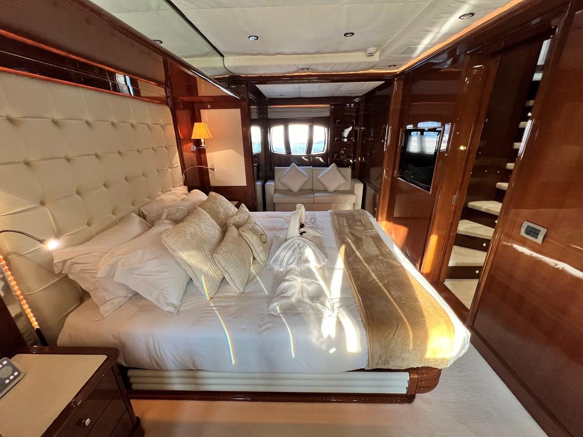 a bed with a white sheet aboard 2009 BENETTI 85 LEGEND Yacht for Sale