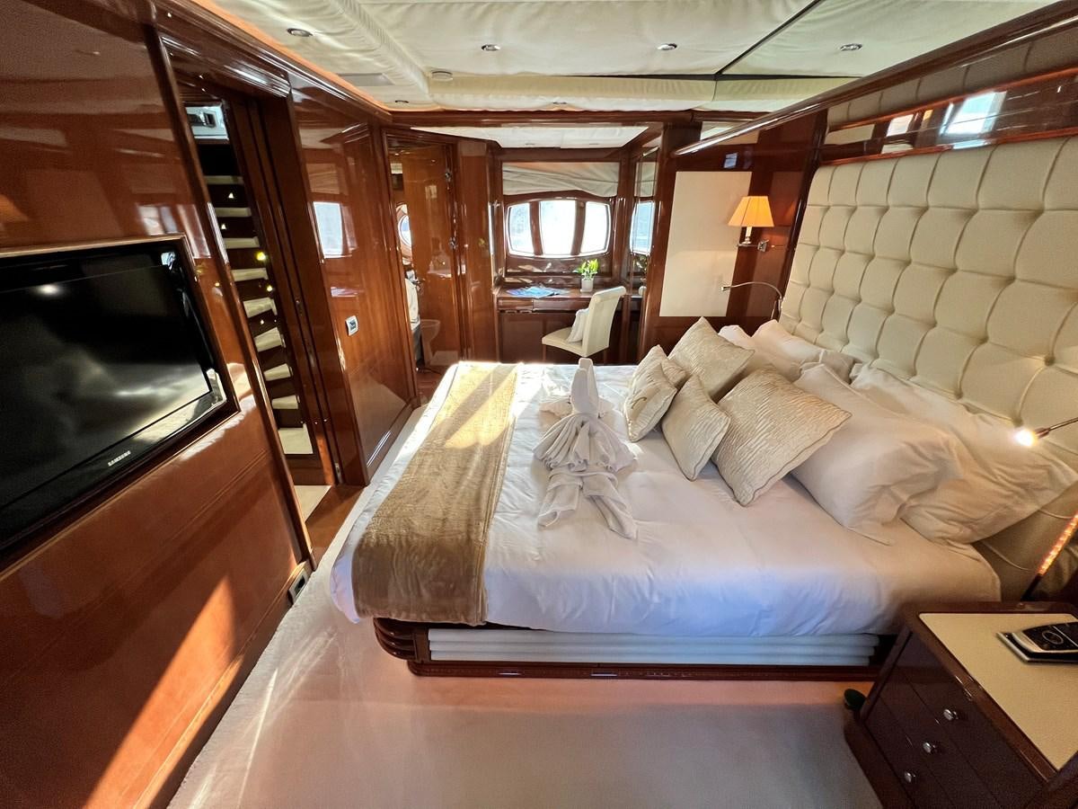 a bed in a room aboard 2009 BENETTI 85 LEGEND Yacht for Sale