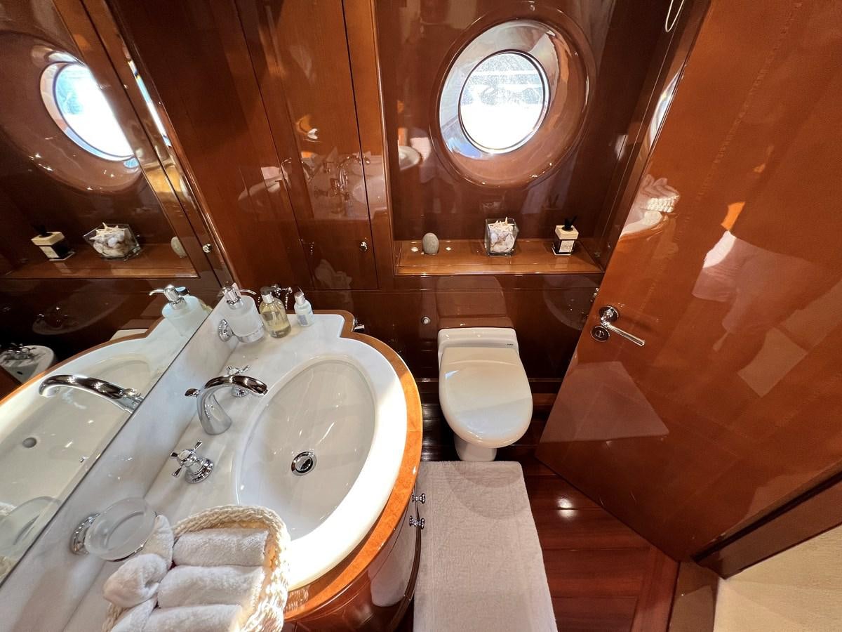 a bathroom with a sink toilet and a bathtub aboard 2009 BENETTI 85 LEGEND Yacht for Sale