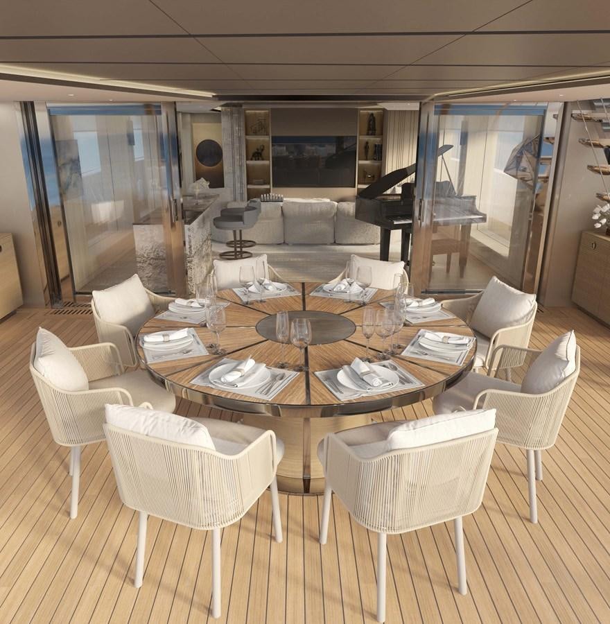 a room with a table chairs and a tv aboard PROJECT SECRET Yacht for Sale