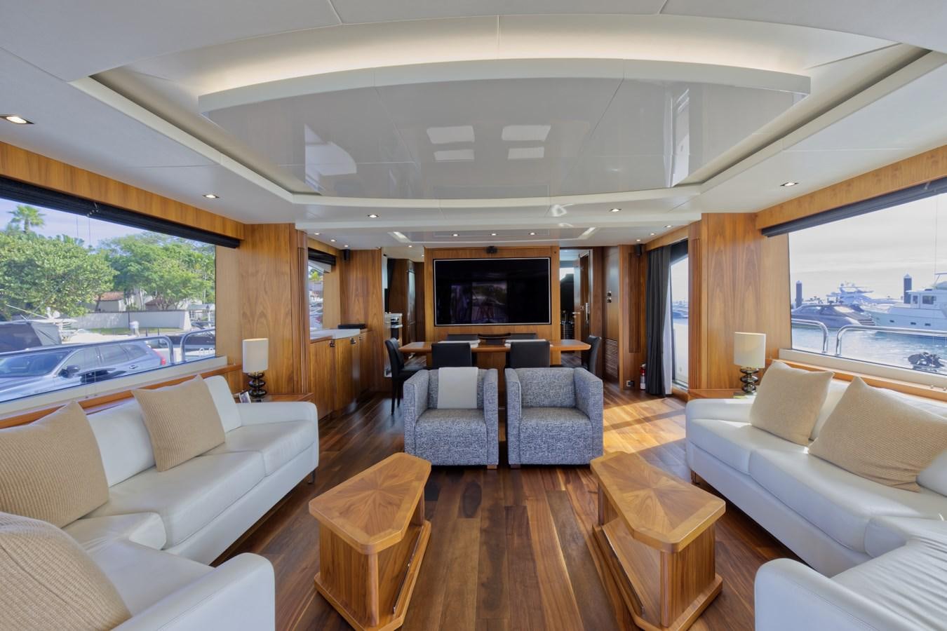 a living room with a large window aboard XSK06864H718 Yacht for Sale