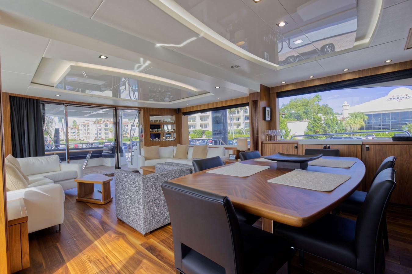 a large living room with a large table and chairs aboard XSK06864H718 Yacht for Sale