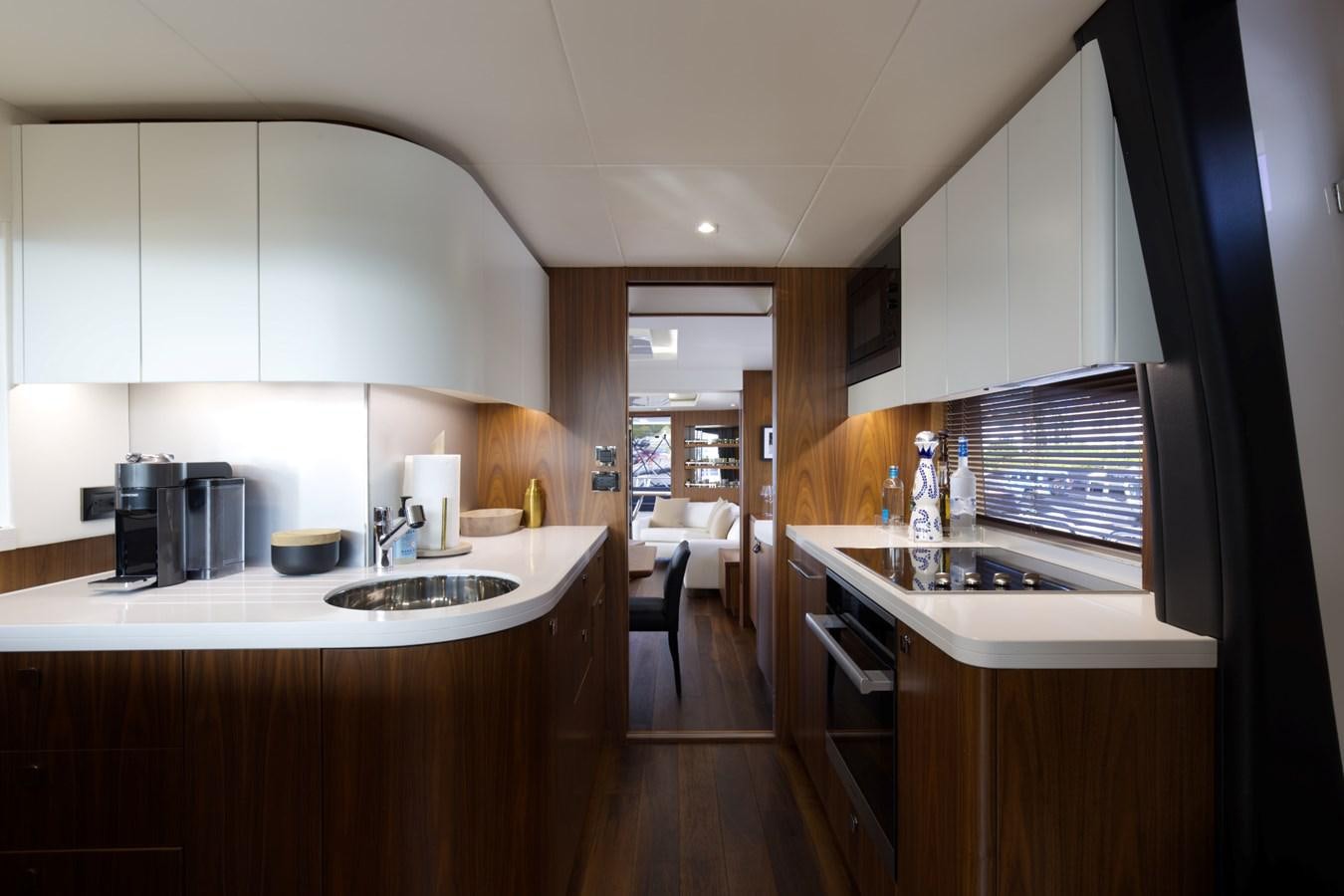 a kitchen with a sink and a stove aboard XSK06864H718 Yacht for Sale