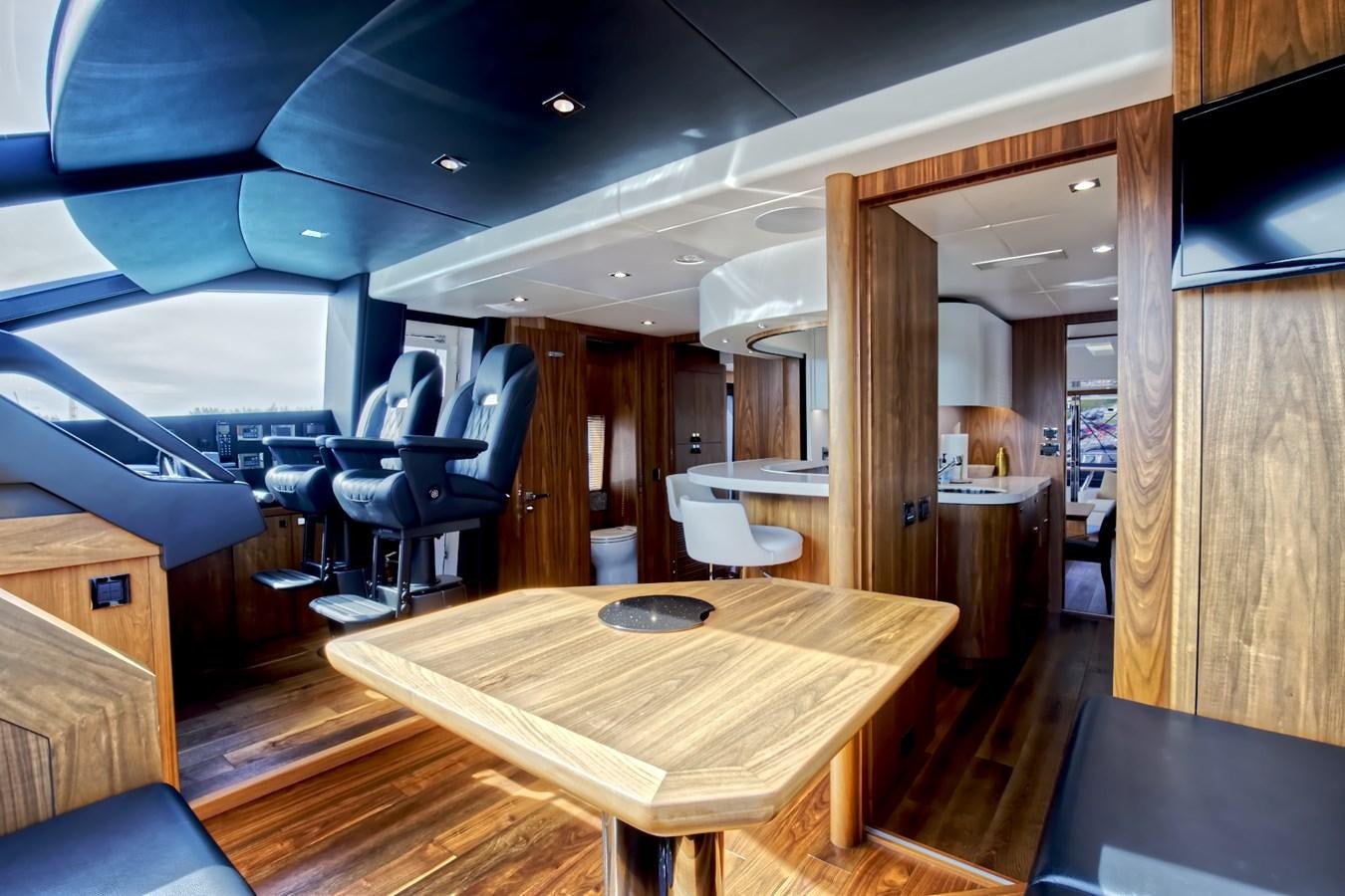 a room with a table and chairs aboard XSK06864H718 Yacht for Sale