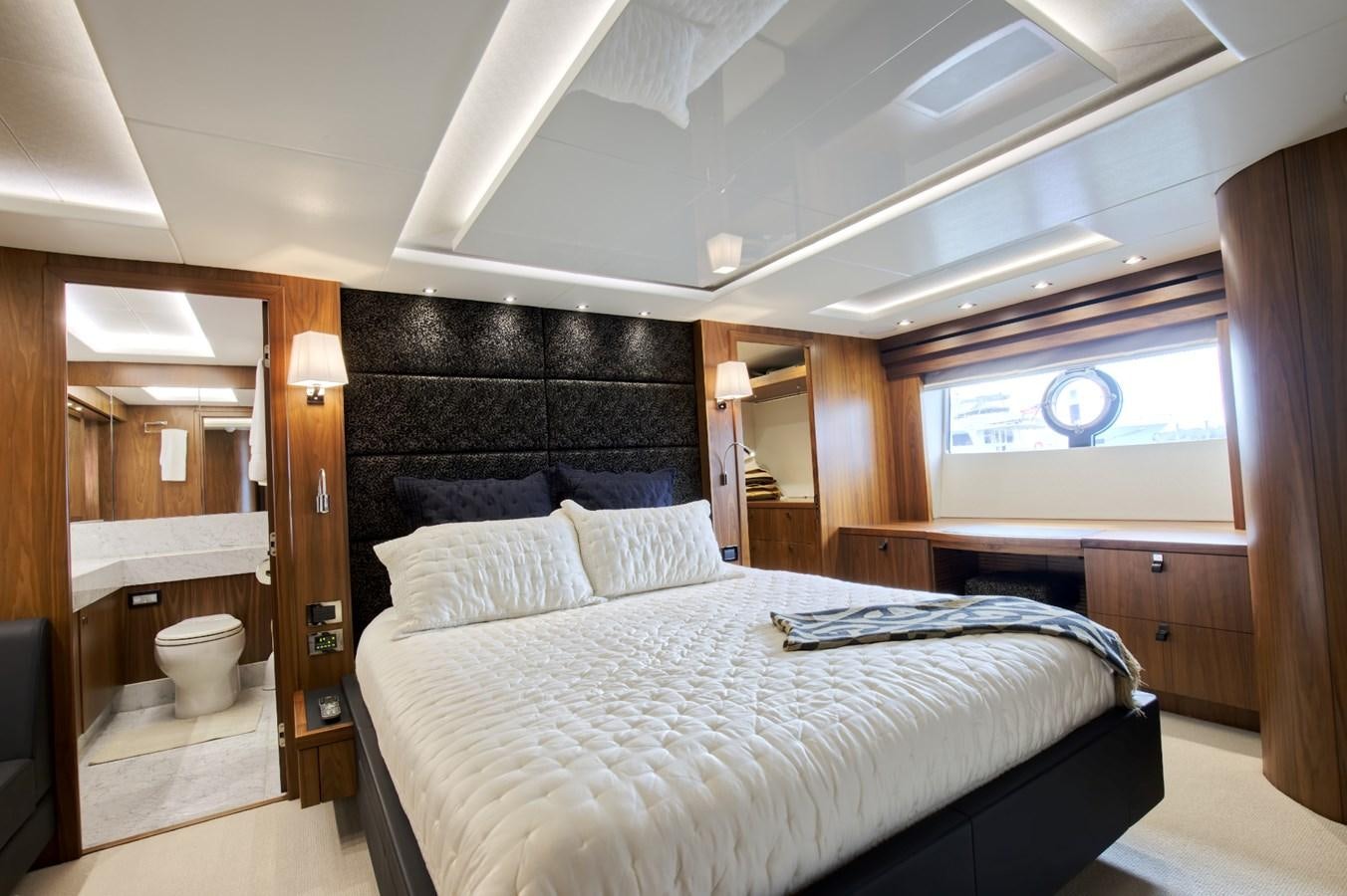 a bedroom with a bed and a mirror aboard XSK06864H718 Yacht for Sale