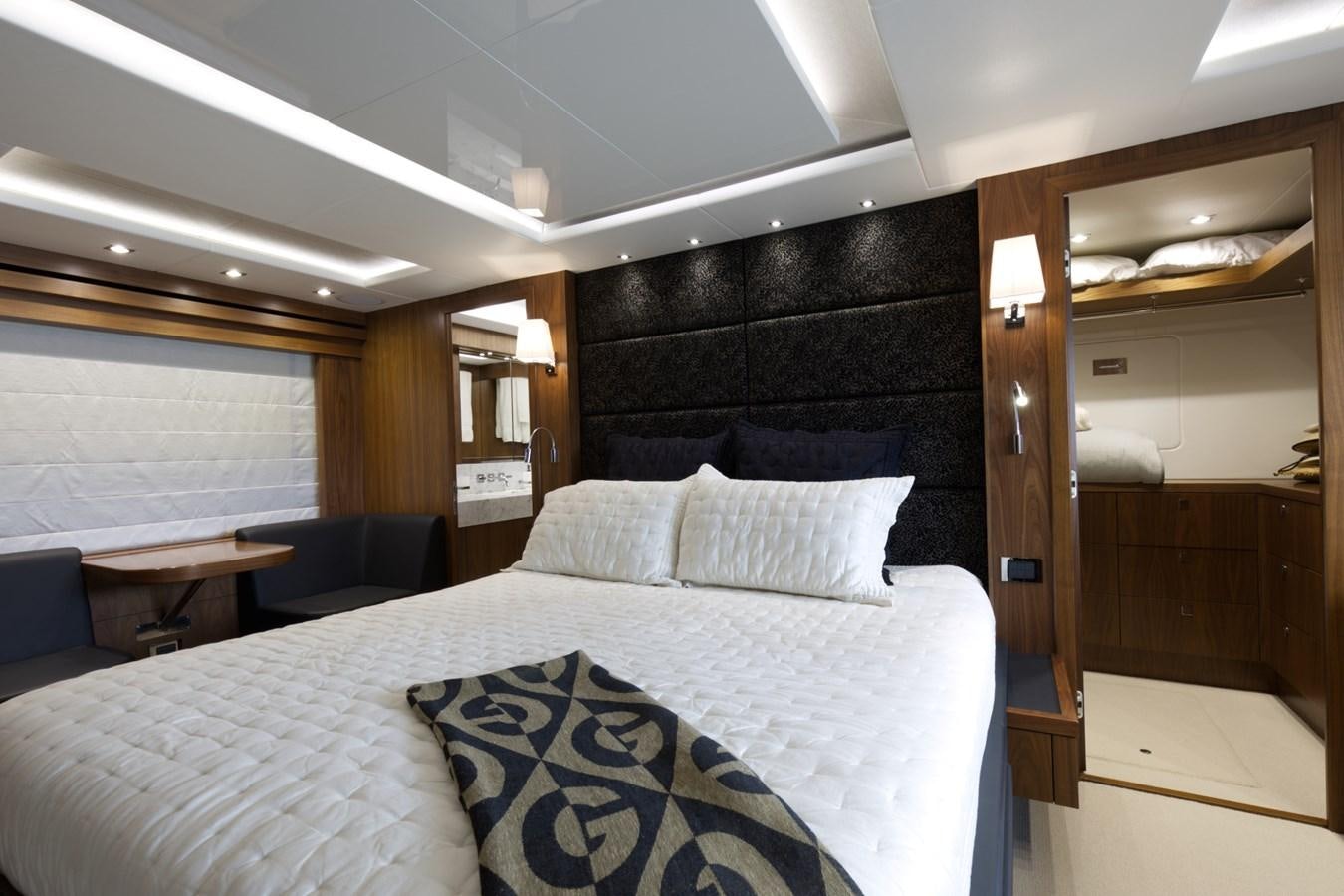 a bed with white sheets aboard XSK06864H718 Yacht for Sale