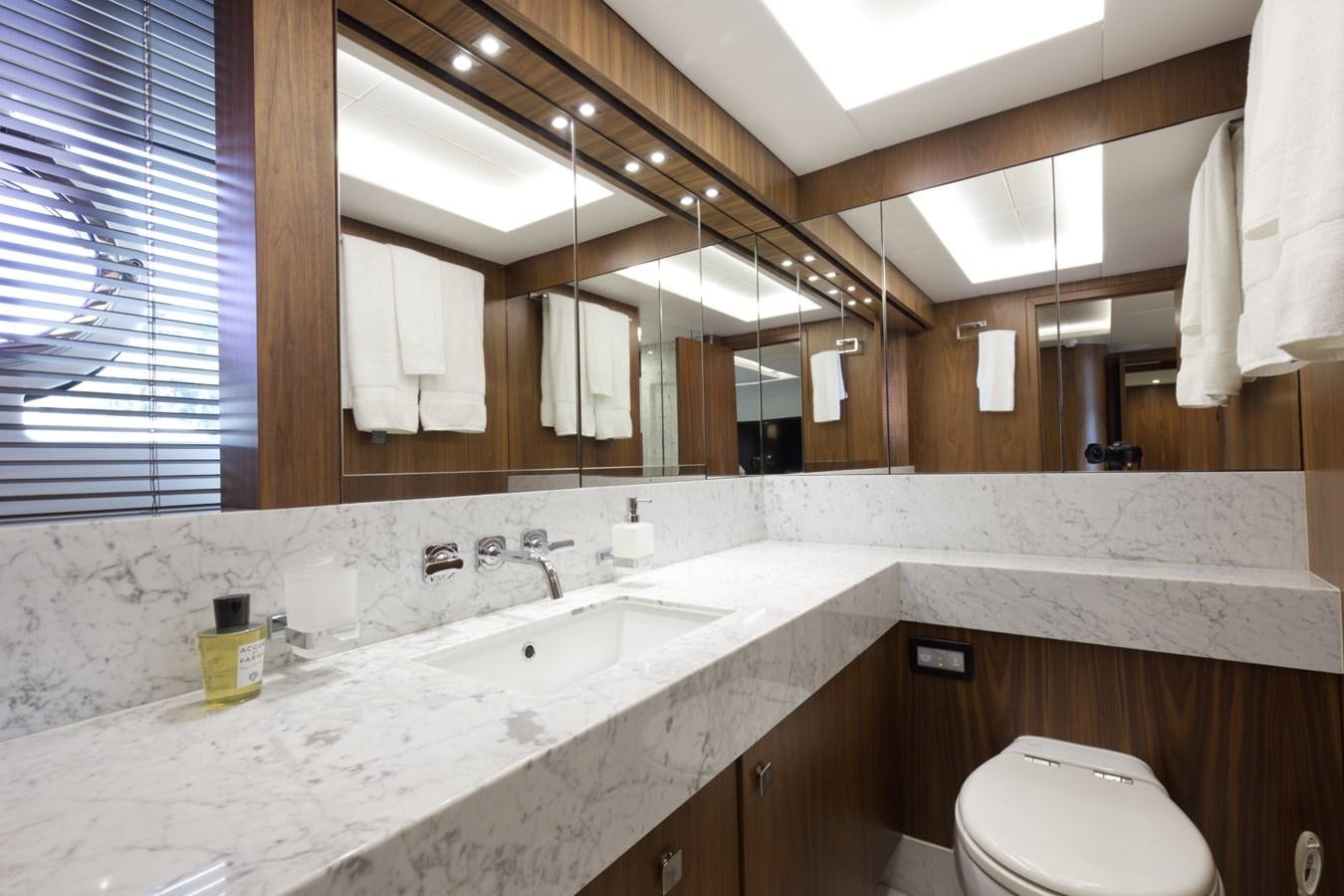 a bathroom with a large mirror aboard XSK06864H718 Yacht for Sale