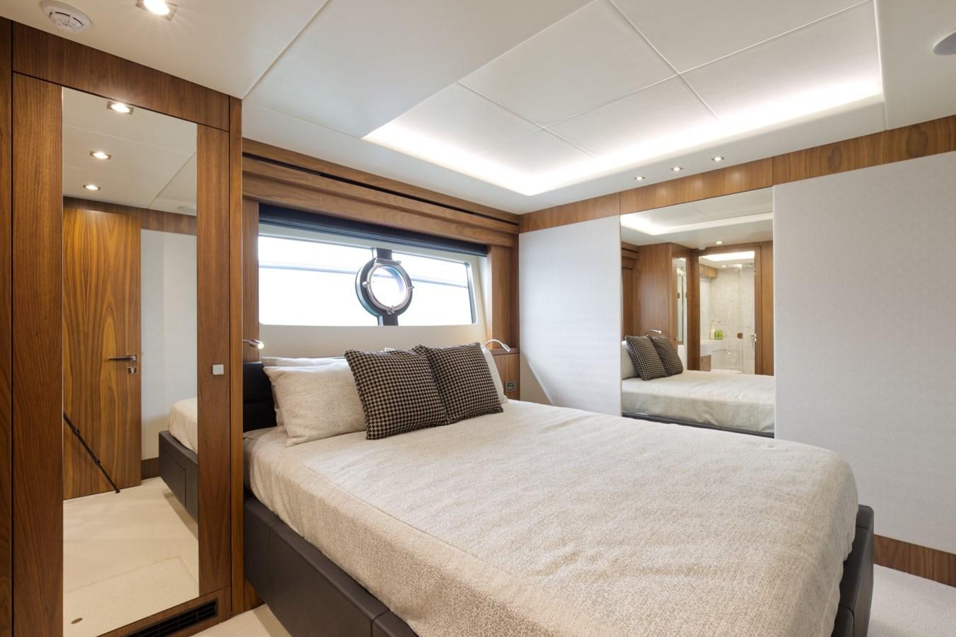 a bedroom with a bed and a window aboard XSK06864H718 Yacht for Sale