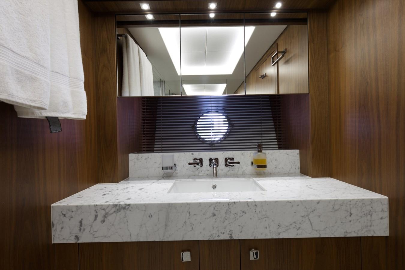 a bathroom with a sink and a mirror aboard XSK06864H718 Yacht for Sale