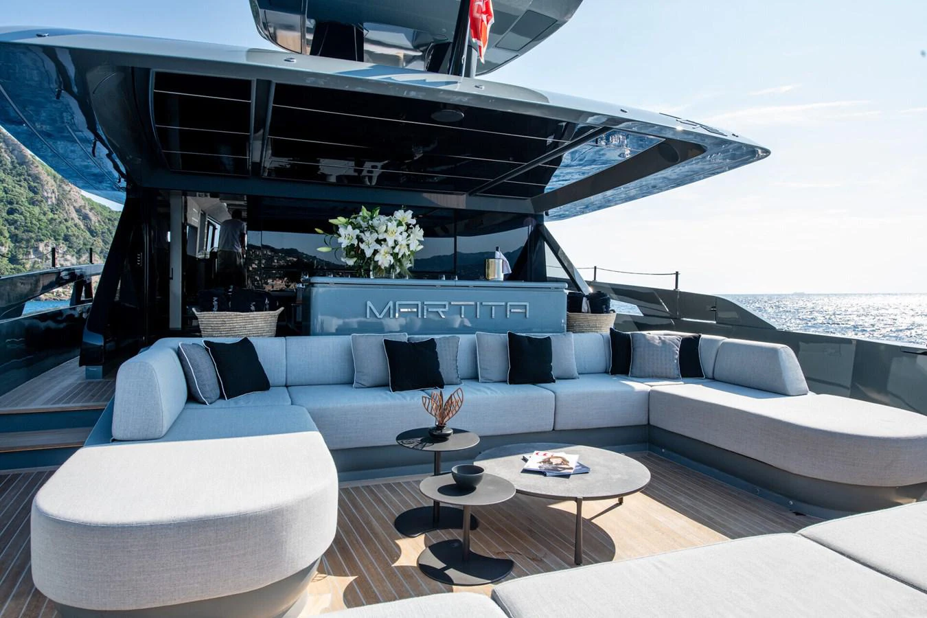 a living room with a large white sofa and a large white sofa aboard MARTITA Yacht for Sale