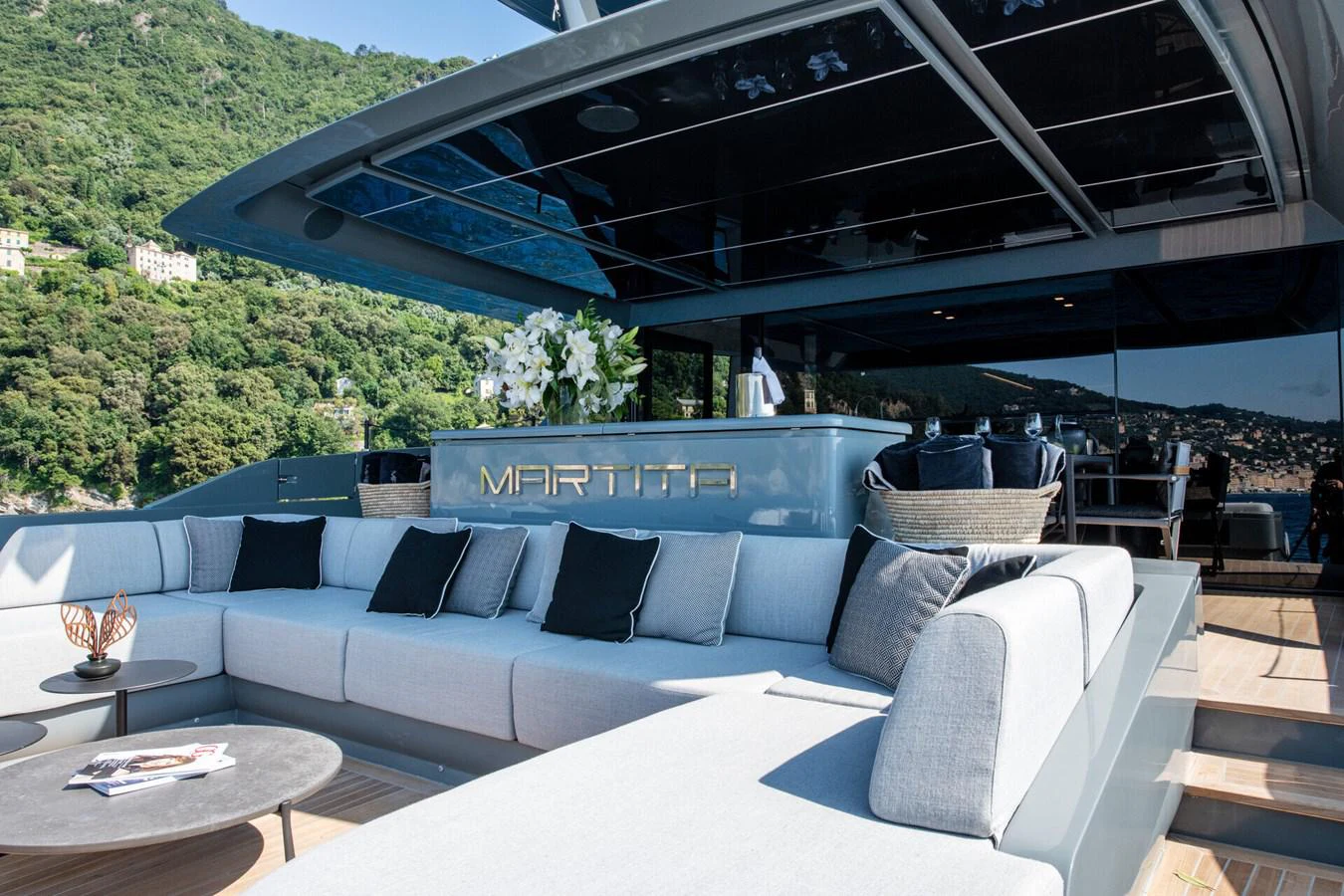 a couch and a table under a tent aboard MARTITA Yacht for Sale