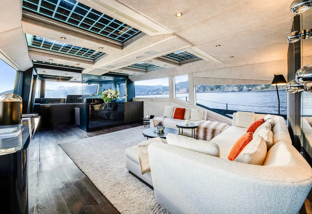 a living room with a large balcony aboard MARTITA Yacht for Sale