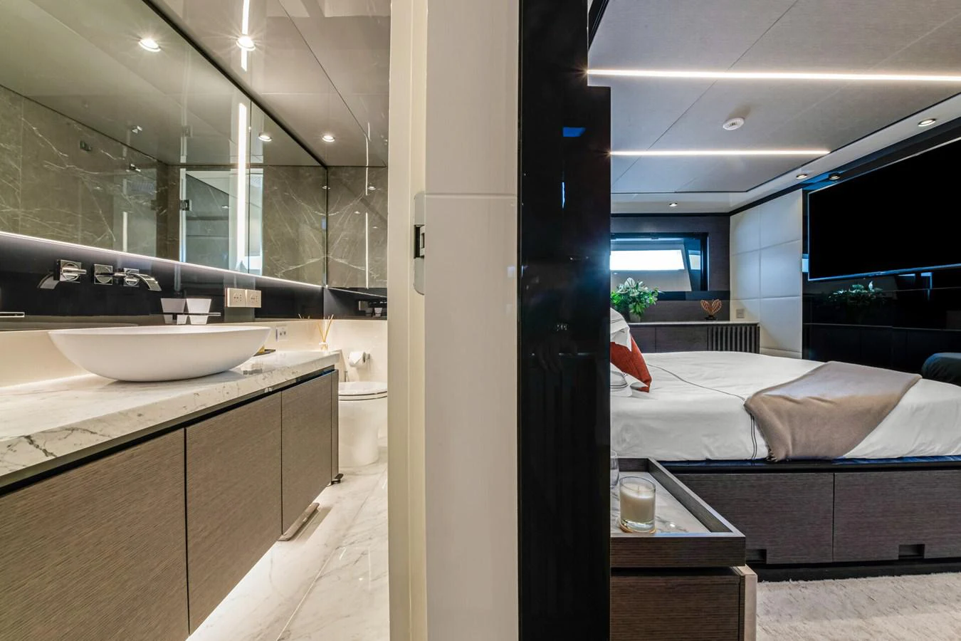 a bathroom with a sink and a bed aboard MARTITA Yacht for Sale
