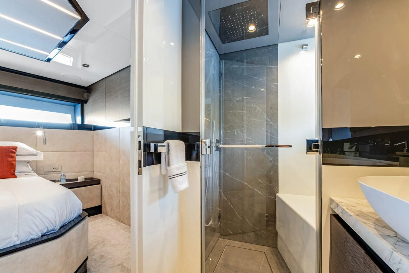 a bathroom with a glass shower aboard MARTITA Yacht for Sale