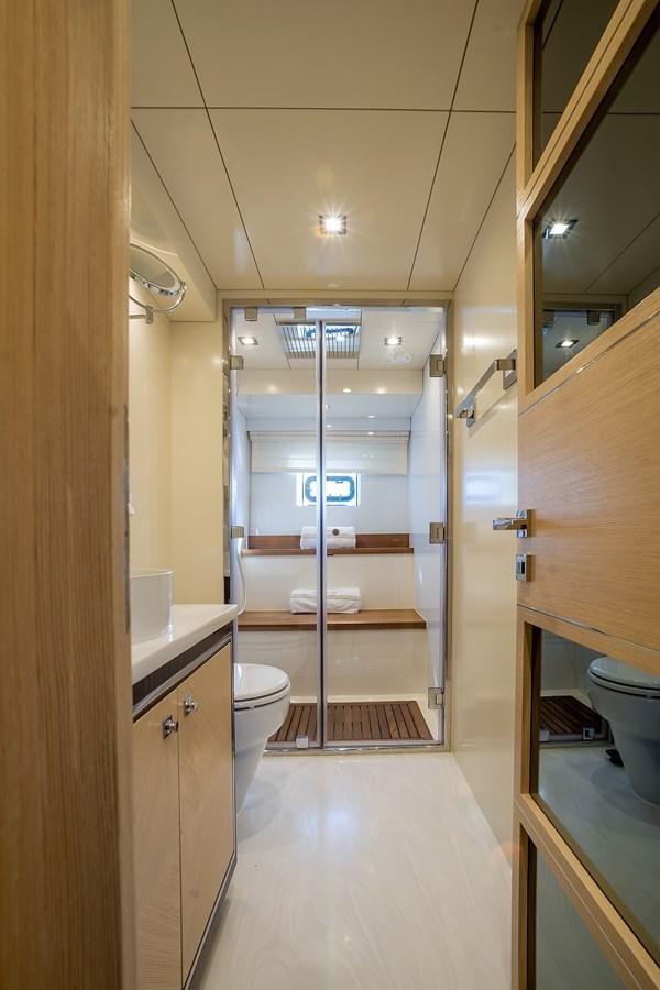 a bathroom with a glass shower aboard AVVENTURA Yacht for Sale