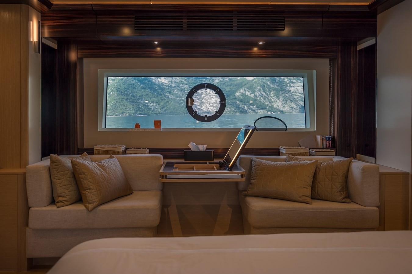 a living room with a large window aboard AVVENTURA Yacht for Sale