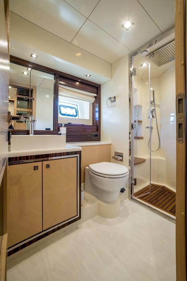 a bathroom with a glass shower aboard AVVENTURA Yacht for Sale