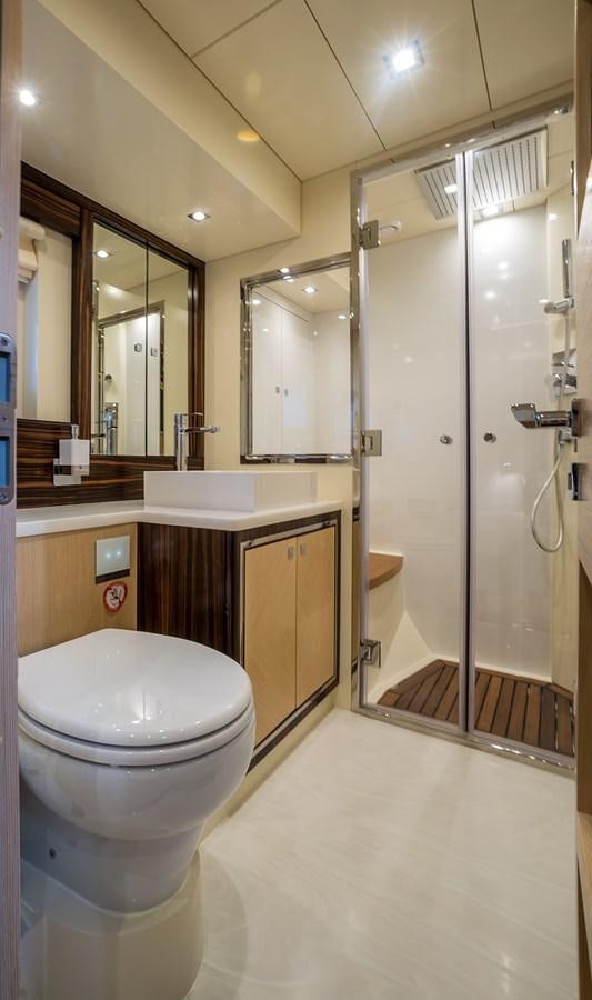a bathroom with a glass shower aboard AVVENTURA Yacht for Sale