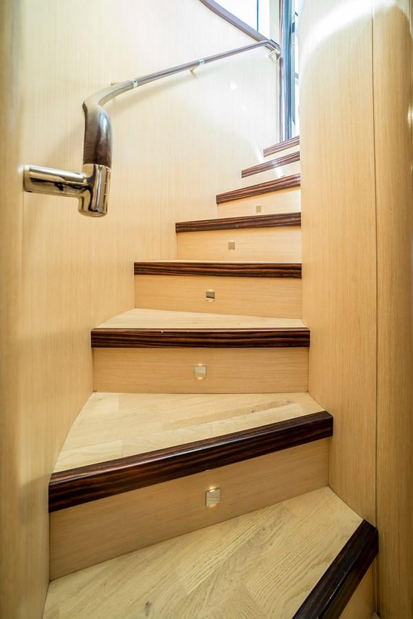 a wooden shelf with a light fixture aboard AVVENTURA Yacht for Sale