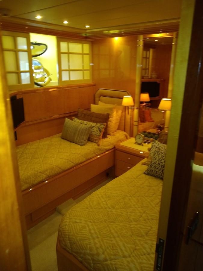 a hotel room with two beds aboard ALCHEMIST Yacht for Sale