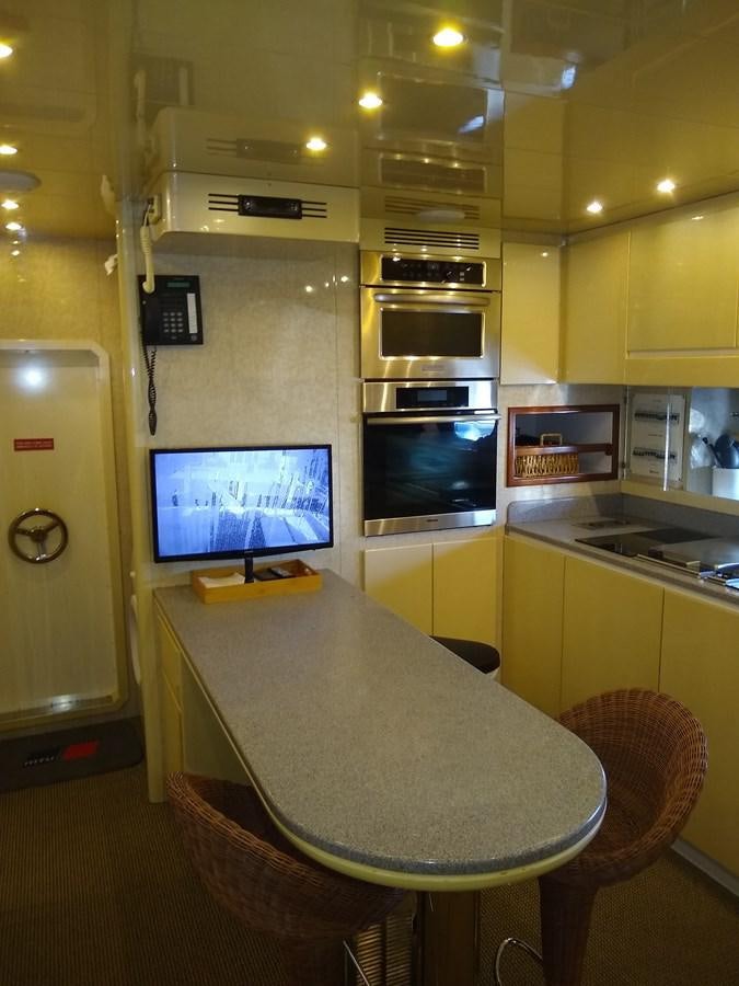 a room with a table and chairs aboard ALCHEMIST Yacht for Sale