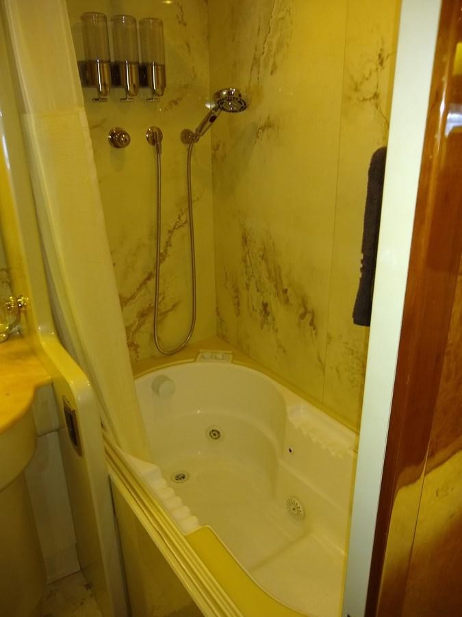 a shower with a shower curtain aboard ALCHEMIST Yacht for Sale