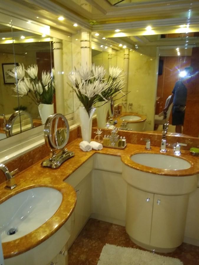a bathroom with a large mirror aboard ALCHEMIST Yacht for Sale