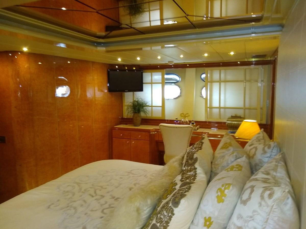 a bed with white sheets aboard ALCHEMIST Yacht for Sale