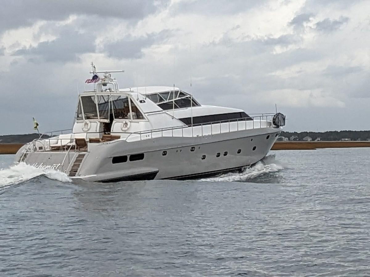 a white boat on the water aboard ALCHEMIST Yacht for Sale