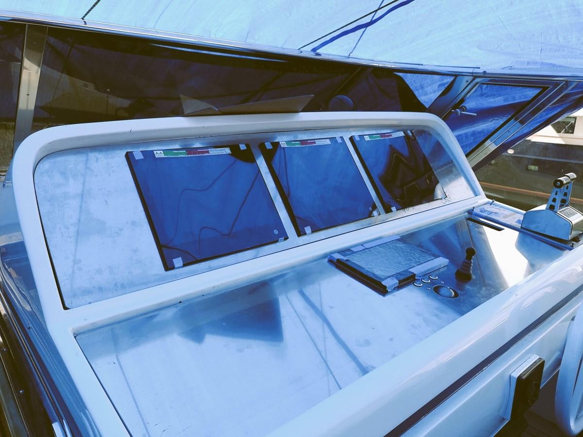 the inside of a white car aboard ALCHEMIST Yacht for Sale