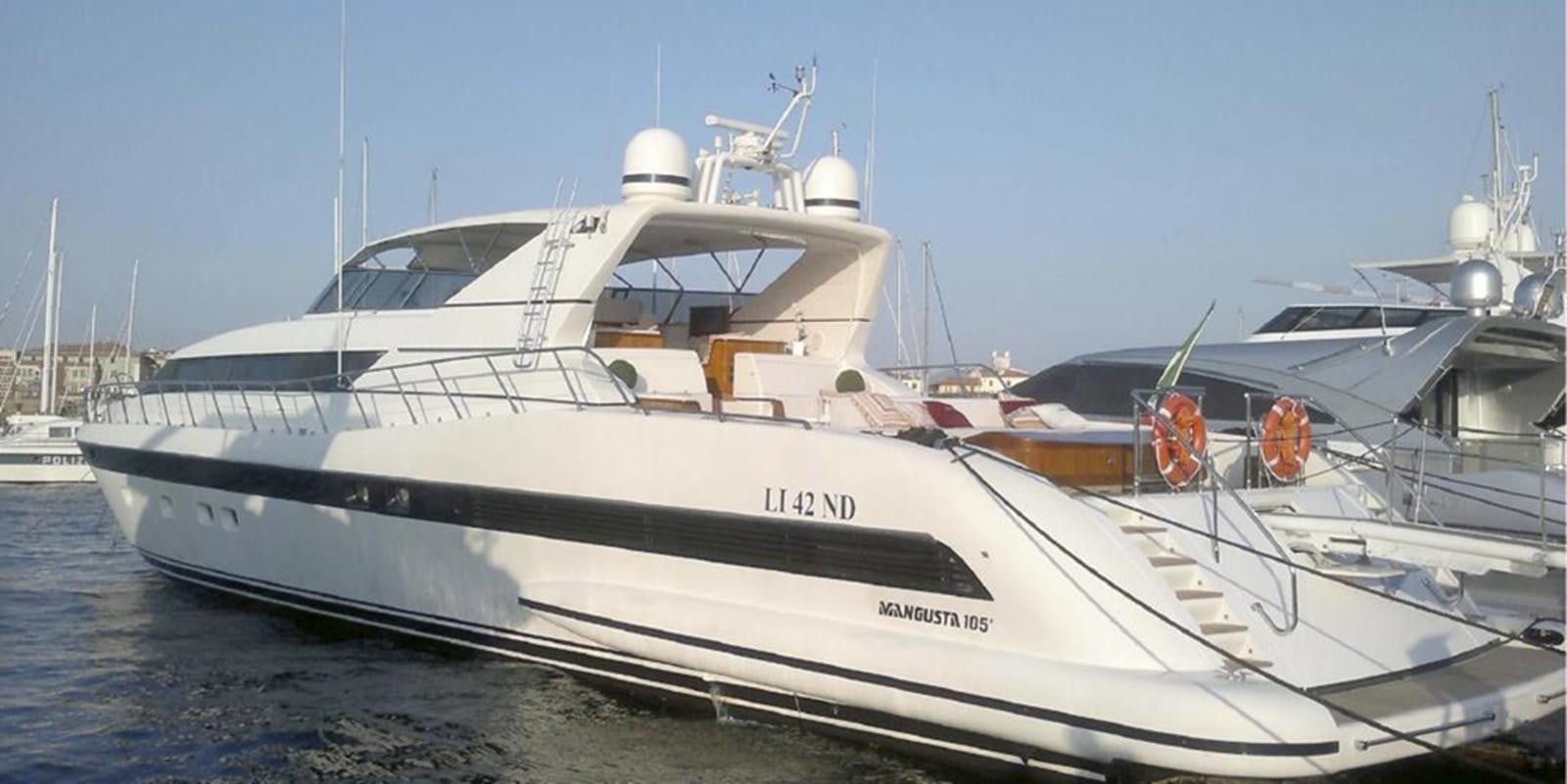 a white yacht on the water aboard VARUNA Yacht for Sale