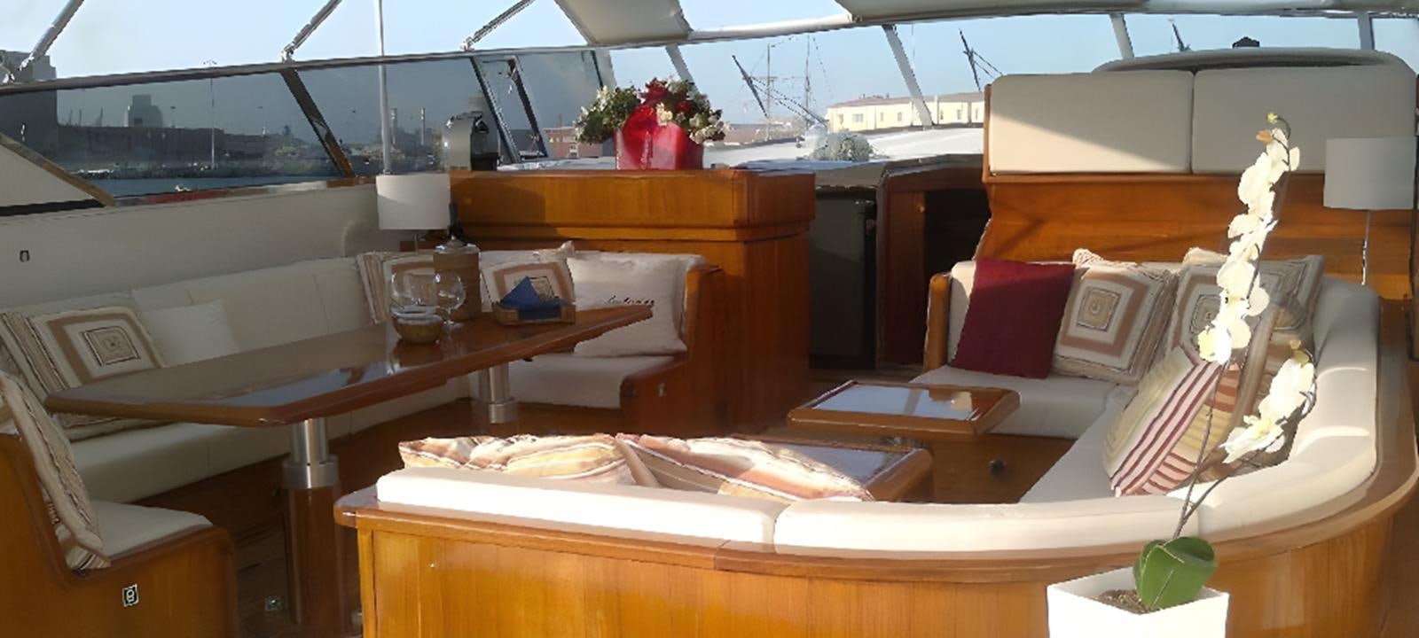 a room with a table and chairs aboard VARUNA Yacht for Sale