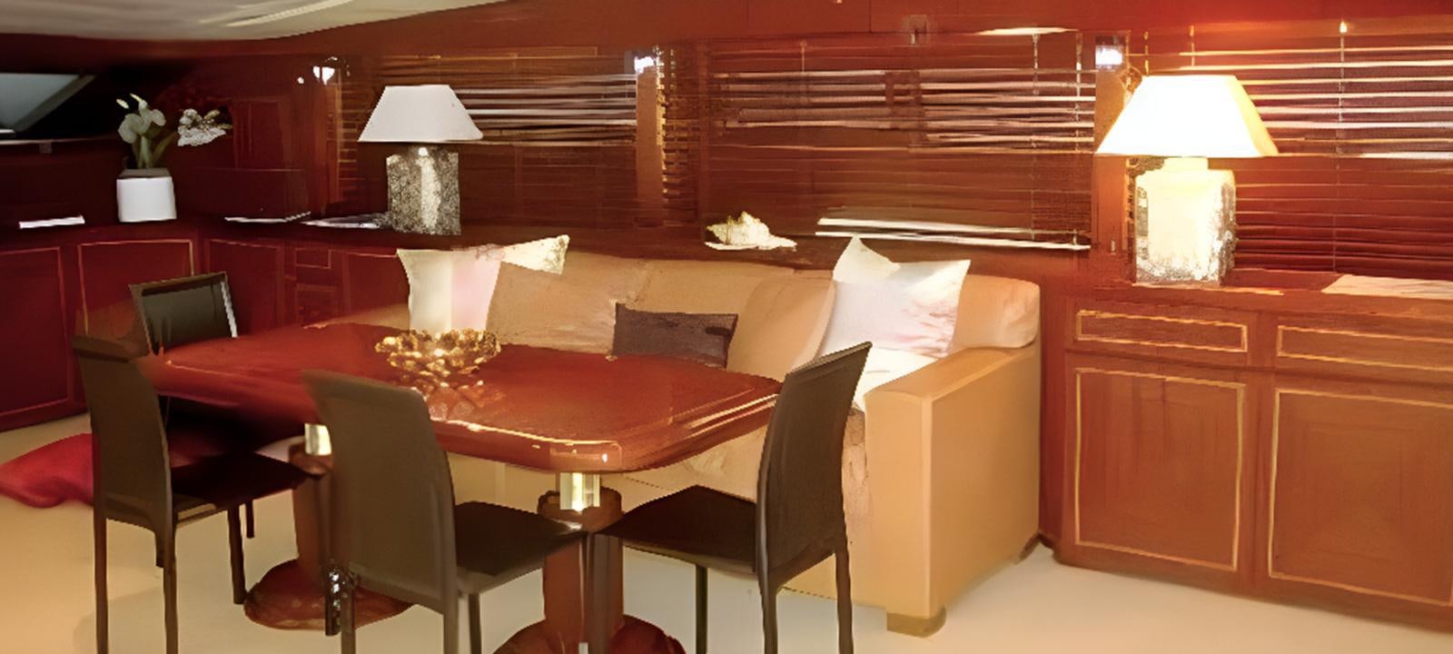 a room with a table and chairs aboard VARUNA Yacht for Sale