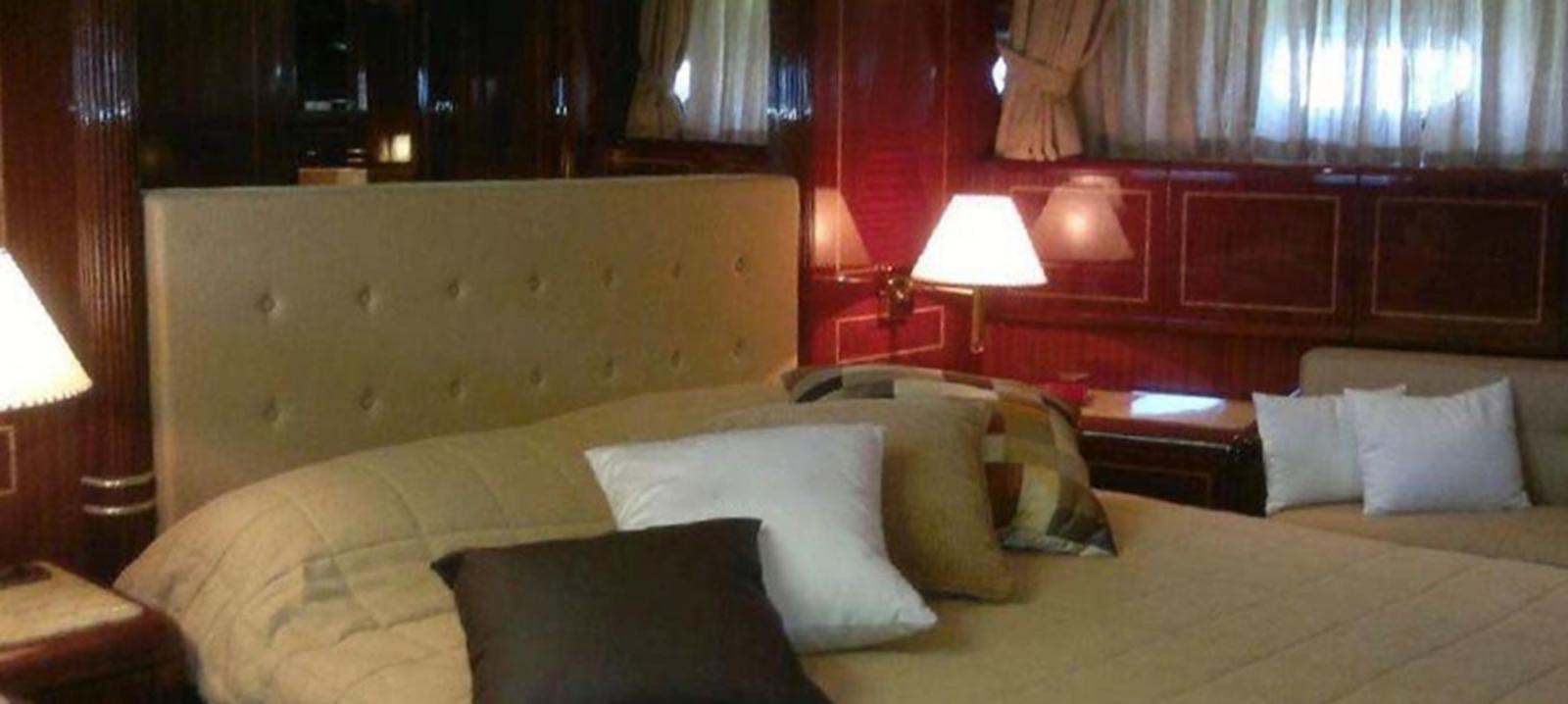 a bed with pillows and pillows aboard VARUNA Yacht for Sale