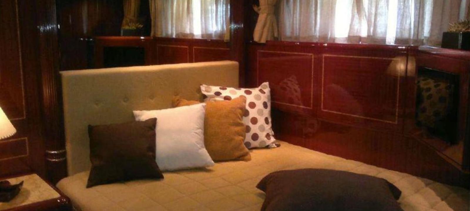 a bed with pillows aboard VARUNA Yacht for Sale