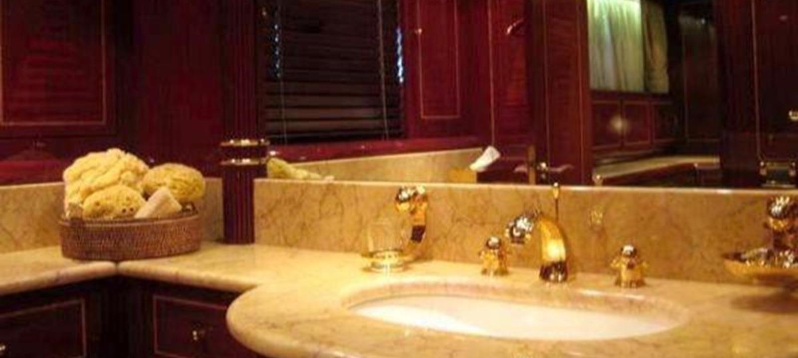 a bathroom with a large mirror aboard VARUNA Yacht for Sale