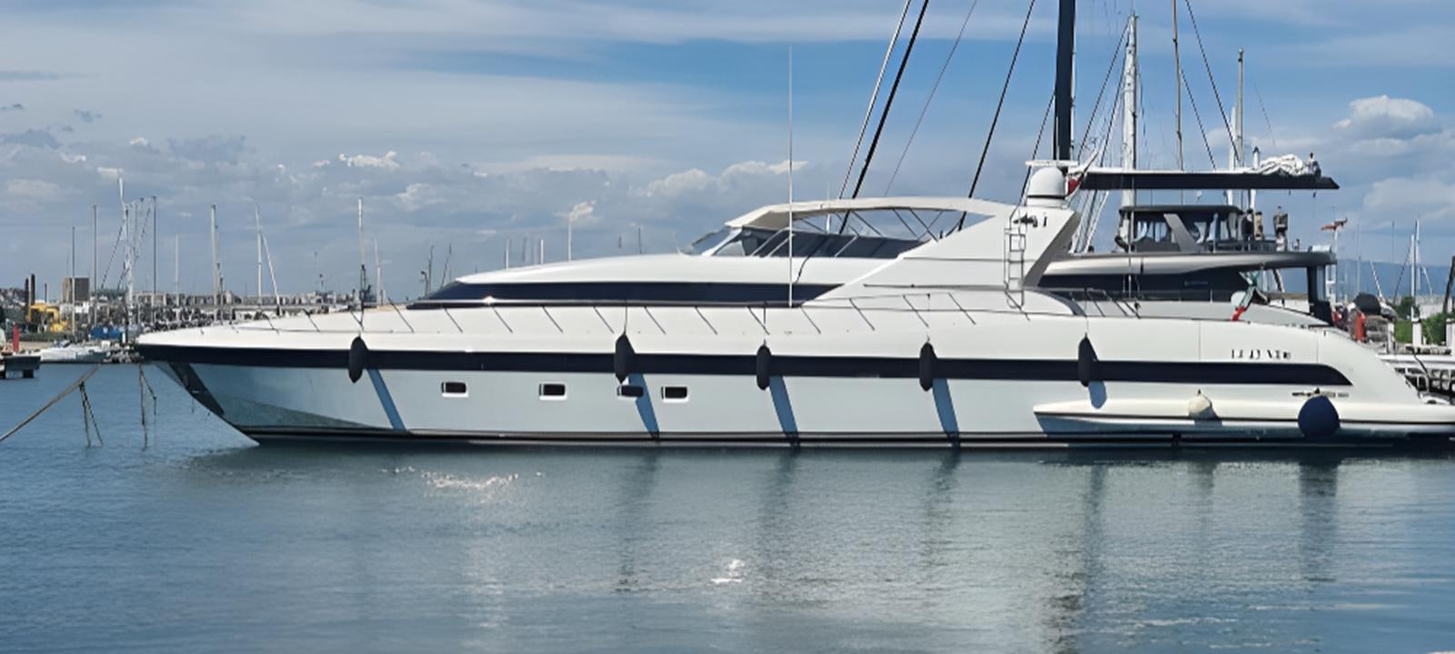 a couple of white boats in a harbor aboard VARUNA Yacht for Sale