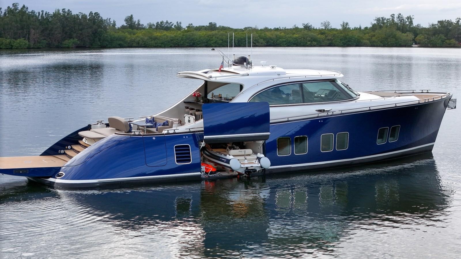 a couple of boats sit in a harbor aboard MADDAMC2 Yacht for Sale