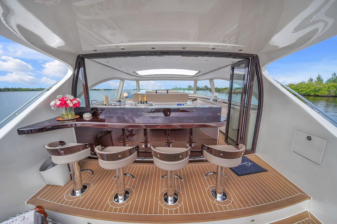 a table with stools on it aboard MADDAMC2 Yacht for Sale