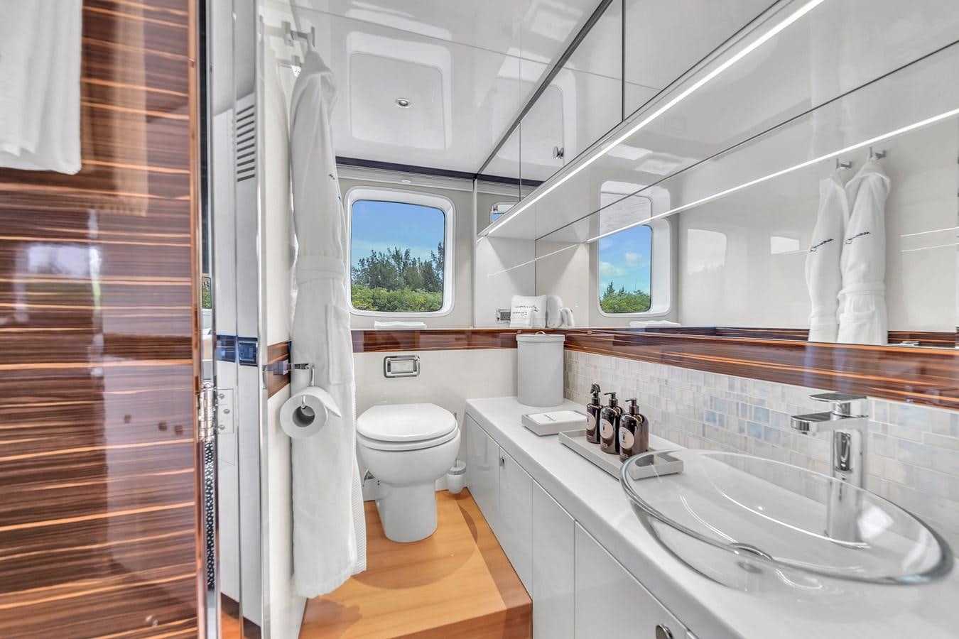a bathroom with a toilet sink and a shower aboard MADDAMC2 Yacht for Sale