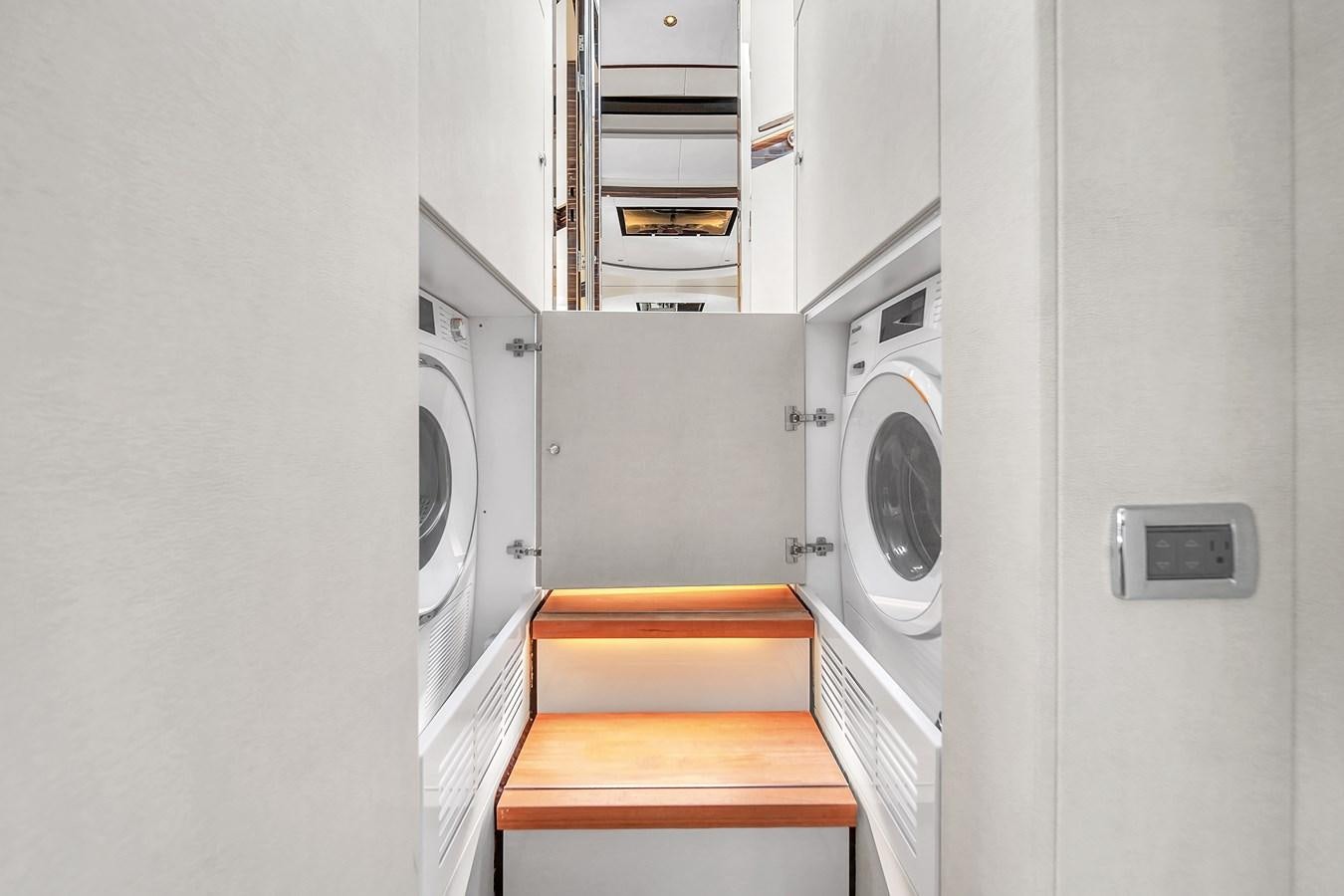 a white and orange laundry room aboard MADDAMC2 Yacht for Sale