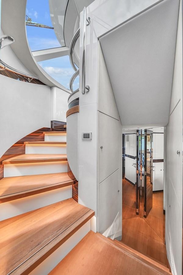 a hallway with a metal railing aboard MADDAMC2 Yacht for Sale