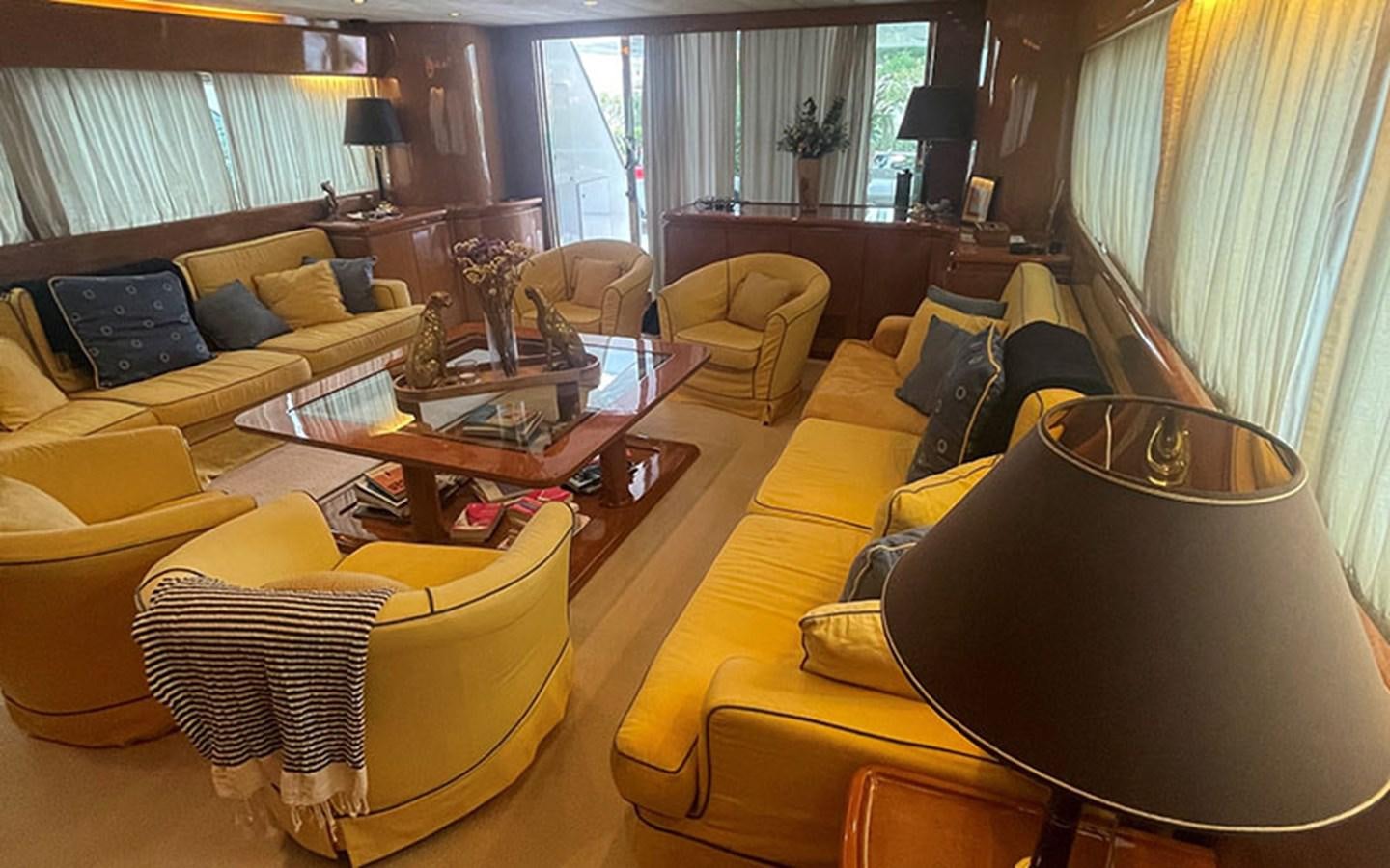 a living room with yellow furniture aboard IT'S A DREAM Yacht for Sale