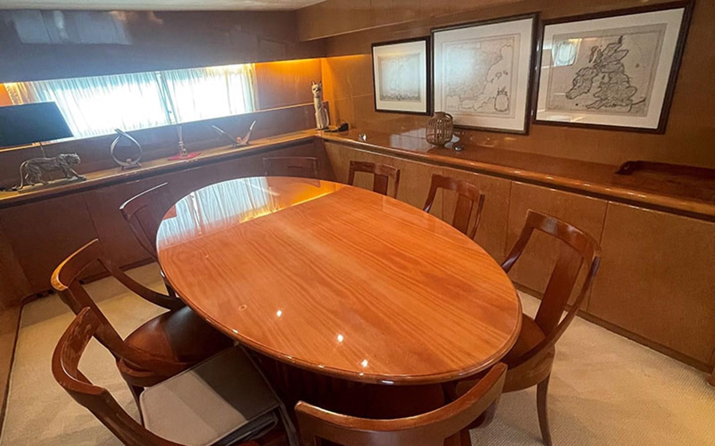 a table with chairs around it aboard IT'S A DREAM Yacht for Sale