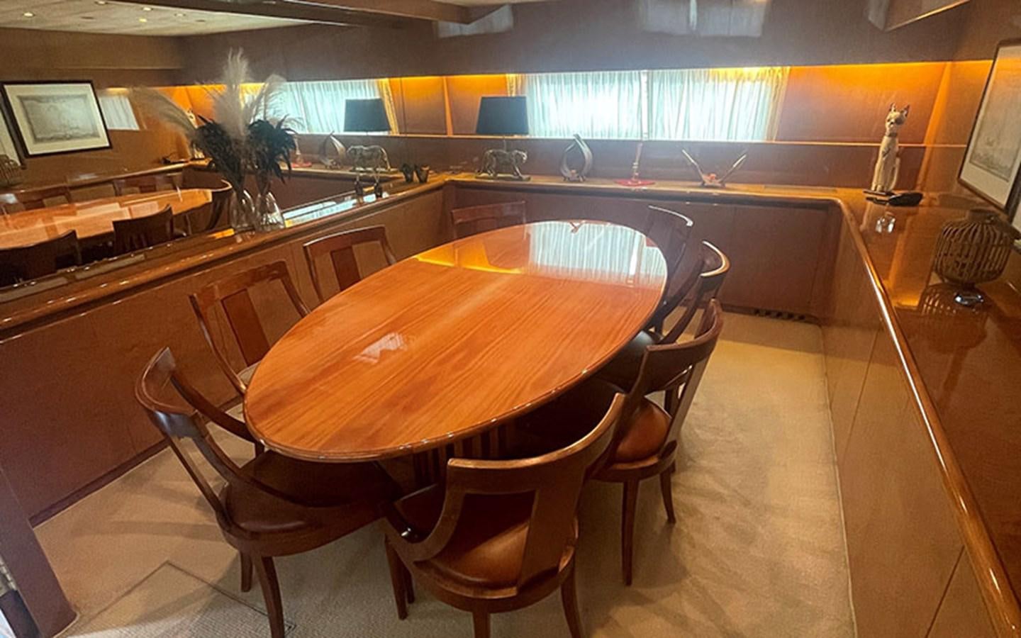 a large kitchen with a table aboard IT'S A DREAM Yacht for Sale